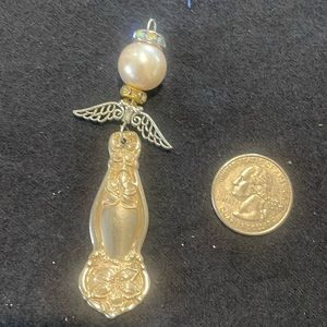 Handmade ornate silver angel pendant/ornament.